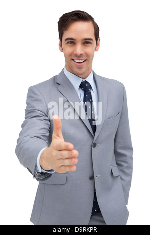 Smiling businessman giving a helping hand Stock Photo
