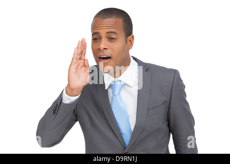 Young businessman calling for someone Stock Photo