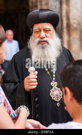 Israel Jerusalem Old City Courtyard Church of the Holy Sepulcher Sepulchre long white bearded priest minister silver topped staff Stock Photo