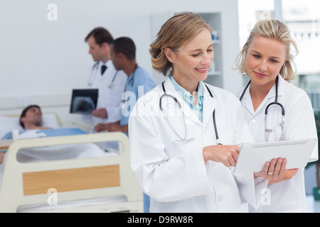 Two women doctors looking at tablet Stock Photo