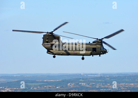 Boeing RAF military Chinook tandem rotor helicopter flying over the City of London England UK Stock Photo