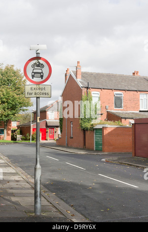 A motor vehicles access restriction road sign on a street, aimed at  preventing a residential road becoming a 'rat run'. Stock Photo