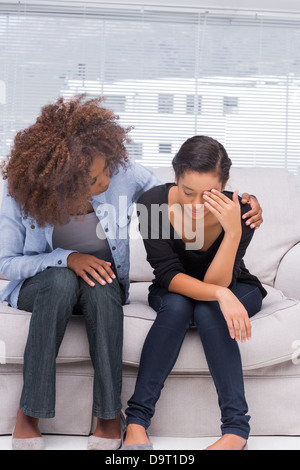 Woman crying next to her therapist Stock Photo