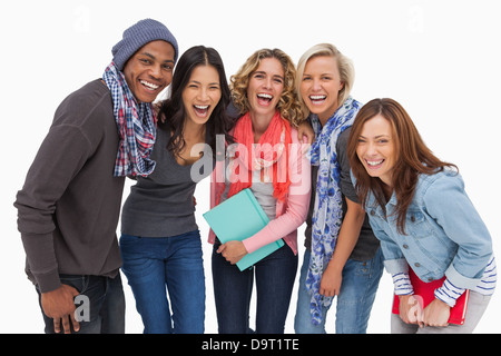 Fashionable students in a row smiling Stock Photo