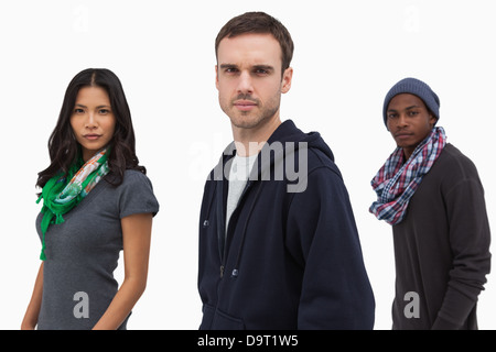 Serious stylish young people in a line Stock Photo