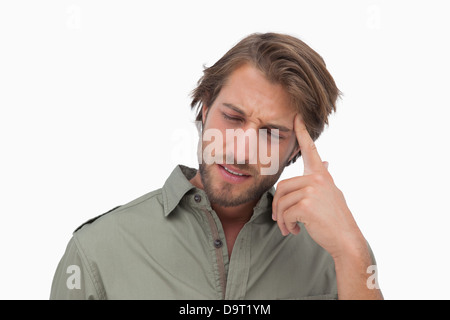 Man with headache touching his head Stock Photo