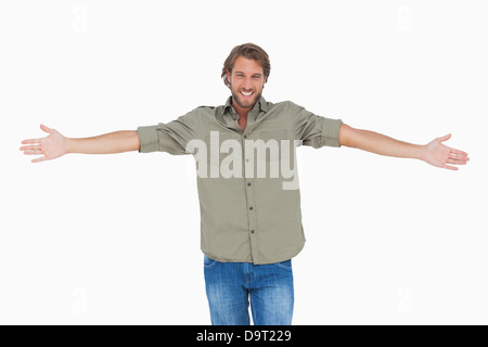 Smiling man with arms open wide Stock Photo