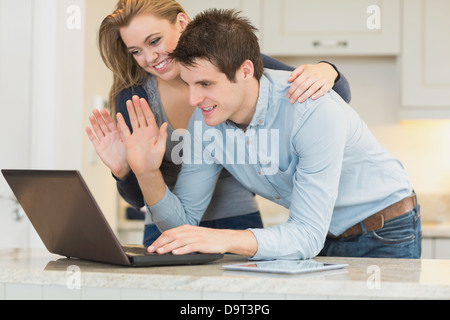 Couple chatting via webcam Stock Photo