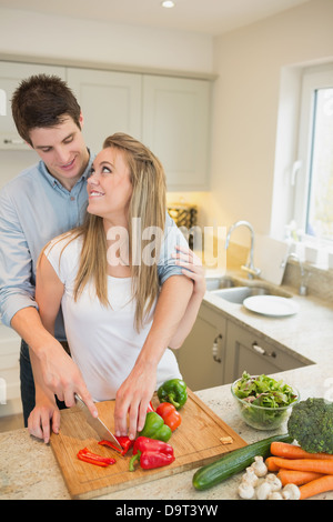 Couple working in the kitchen together Stock Photo