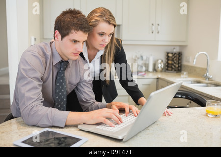 Couple watching something on the laptop Stock Photo