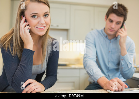 Couple on mobile phones Stock Photo