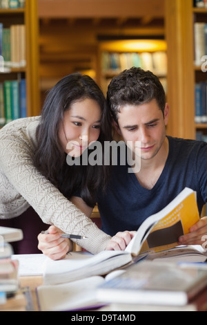 Two students studying in a library Stock Photo