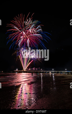 Spectacular fireworks light up the sky over Glenelg to mark the beginning of the new year. Stock Photo