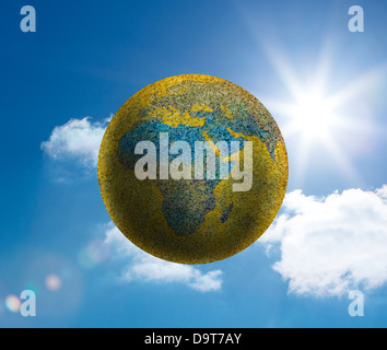 Globe floating in the sky Stock Photo