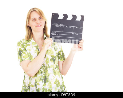 Beautiful woman with clapperboard having fun on location Stock Photo