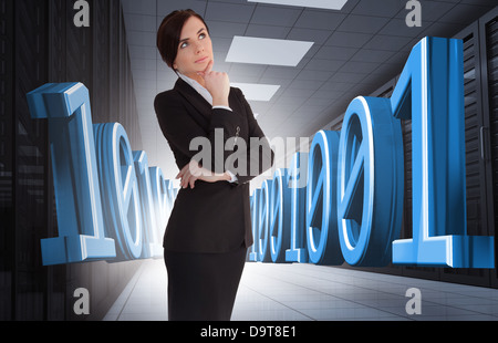 Businesswoman thinking in data center Stock Photo