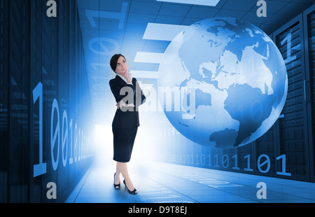 Businesswoman standing in data center with earth and binary code graphics Stock Photo