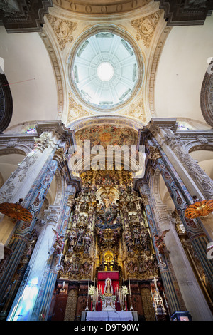 High Altar and dome in Church of the Divine Savior interior - Iglesia Colegial del Salvador in Seville, Spain. Masterpiece Baroque altarpiece from 177 Stock Photo