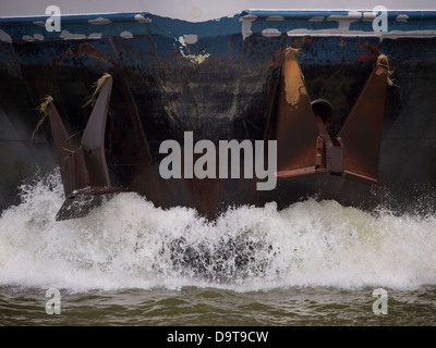 Closeup of two anchors on the bow of a moving ship in the port of Rotterdam, the Netherlands Stock Photo