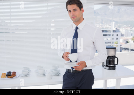Businessman having a coffee during the break Stock Photo