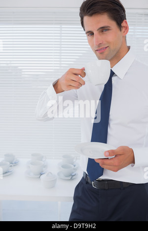 Handsome businessman having a coffee Stock Photo