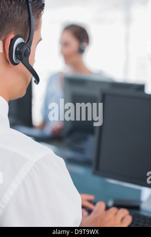 Business man working in a call centre Stock Photo