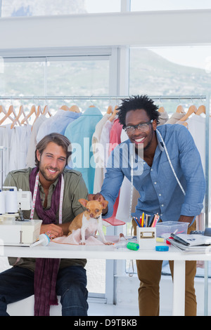 Two fashion designers with chihuahua Stock Photo