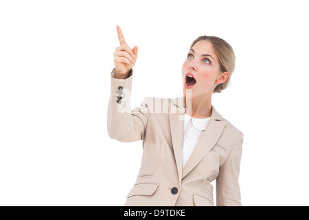 Surprised businesswoman pointing something Stock Photo