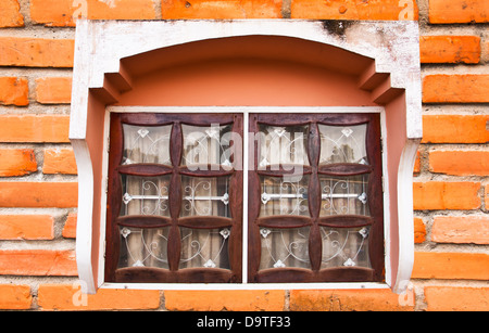 Window on a brick wall. Used to decorate the outside of the building. Stock Photo