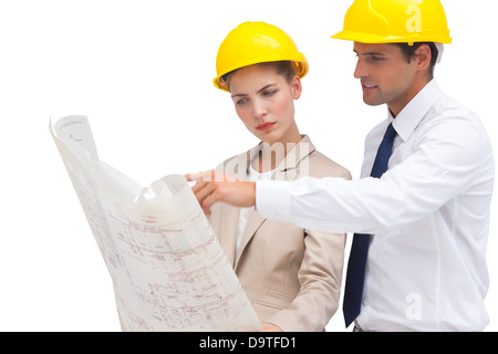 Serious architects looking at construction plan Stock Photo