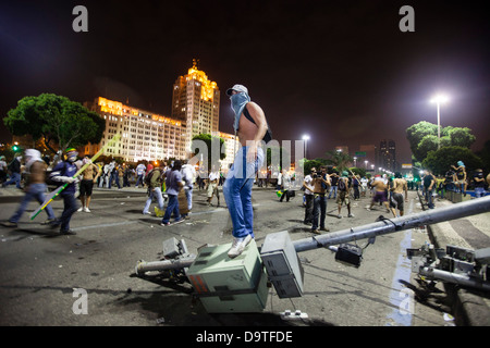 Brazil protest Rio de Janeiro Street vandalized by protesters Ministry of the Army building in background symbol of repression Stock Photo