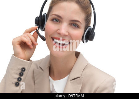 Laughing operator talking on headset Stock Photo