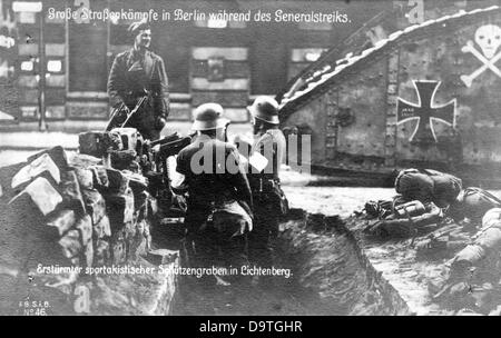 German Revolution 1918/1919: A trench, which was originally made by Spartacists and was conquered by government troops (white armbands), is pictured in Berlin, Germany, during the street fights in early January 1919. Fotoarchiv für Zeitgeschichte Stock Photo