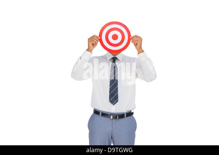 Businessman hiding his face behind a red target Stock Photo