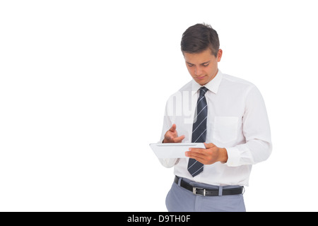 Smiling businessman using tablet Stock Photo