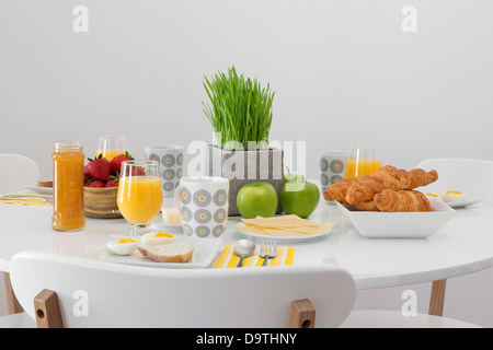 Fresh tasty breakfast served on a white table. Stock Photo