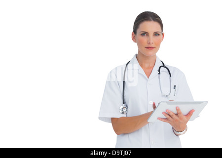Cheerful nurse using her tablet Stock Photo