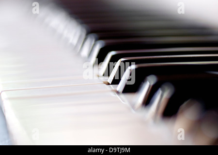 Closeup of a pianos black and white keys. Selective focus with shallow depth of field. Stock Photo