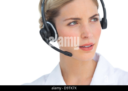 Serious nurse working with headset Stock Photo
