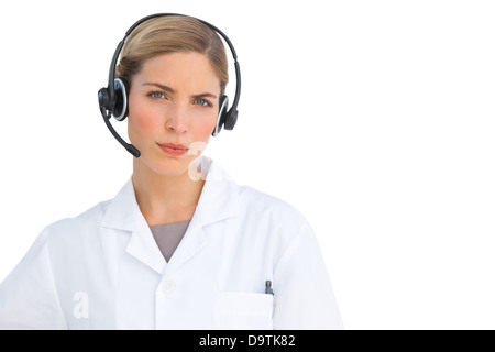 Serious nurse using headset Stock Photo