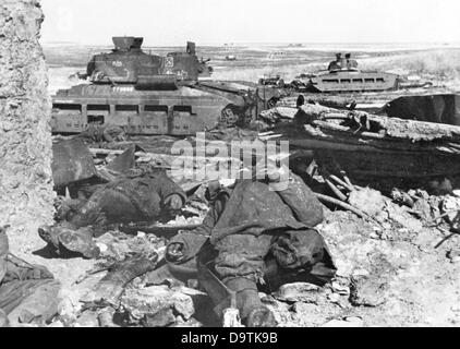 The Nazi Propaganda! on the back of the image reads: 'Demolished, destroyed and defeated. Soviet divisions put up a strong resistance in the area around Kharkov. Several hundred cars, numerous destroyed tanks mark the location of the Bolshevist defeat.' Image form the Eastern Front/Ukraine, 10 April 1943. The attack on the Soviet Union by the German Reich was agreed on in July 1940 and prepared since December 1940 as the 'Operation Barbarossa'. On 22 June 1941, the German Wehrmacht started the invasion of the Soviet Union. Fotoarchiv für Zeitgeschichte Stock Photo