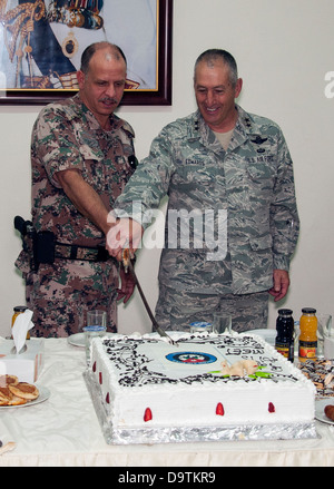 HRH Prince Ali bin Al Hussein of Jordan (left) and Major General H. Michael Edwards, the Adjutant General of the Colorado National Guard, ceremoniously cut the cake at the opening ceremonies of an Eager Lion event at a training base in Northern Jordan. Ea Stock Photo