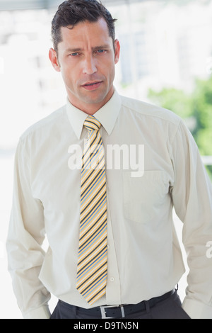 Businessman with hands in pocket Stock Photo