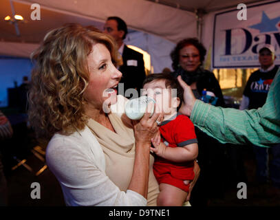 FILE PHOTO: Fort Worth, Texas, USA. 26th June 2013. - Texas Senator WENDY DAVIS attempted a 13 hour filibuster to block an anti-abortion bill, that would close nearly all of the abortion clinics in the state. Senator Davis succeeded for 11 hours before the filibuster was stopped by Lt. Gov. Dewhurst. For the rest of the session protestors halted the proceedings and the vote could not be completed before the midnight deadline. PICTURED: Nov. 15, 2011 - Fort Worth, Texas, U.S. - WENDY DAVIS, Texas State Senator District 10 feeds a baby a bottle during the kick off party for her re-election campa Stock Photo