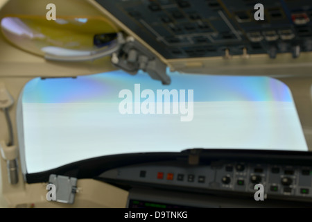 cockpit windscreen pilots view from a private jet flying above the cloud Stock Photo