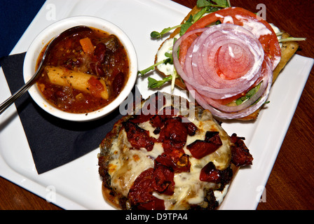 Minestrone soup grilled portobello mushroom burger melted Havarti cheese  vegetarian platter Stock Photo