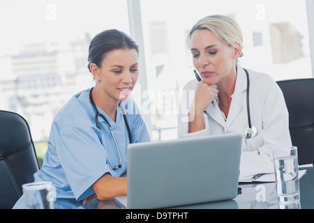 Two women doctors working on a laptop Stock Photo