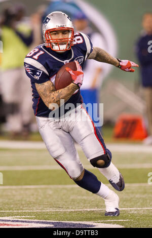 June 26, 2013, - Aaron Hernandez arrested in connected with the death of Odin Lloyd and then released by the New England Patriots. PICTURED: November 13, 2011: New England Patriots tight end Aaron Hernandez (81) runs with the ball during the NFL game between the New England Patriots and the New York Jets at the MetLife Stadium in East Rutherford, New Jersey. The Patriots beat the Jets, 37-16. Stock Photo