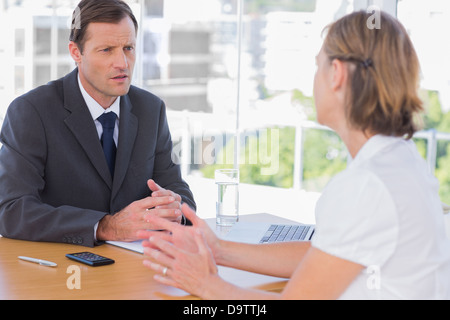 Businessman having a discussion with a job applicant Stock Photo