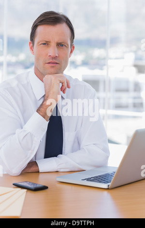 Handsome businessman posing in his office Stock Photo